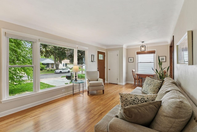 805 California Ave W, Saint Paul, MN 55117 - living area featuring light wood-style flooring and baseboards