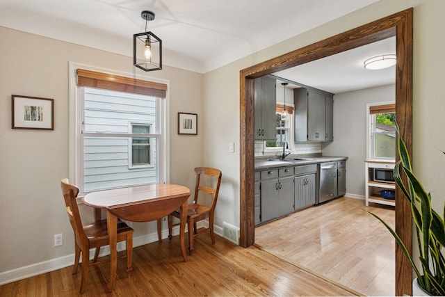 805 California Ave W, Saint Paul, MN 55117 - dining area with baseboards and light wood-style flooring
