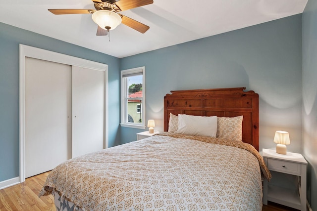 805 California Ave W, Saint Paul, MN 55117 - bedroom with wood finished floors, a closet, baseboards, and a ceiling fan