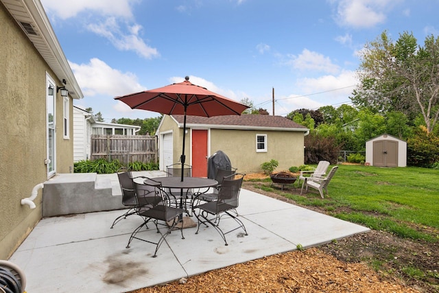 805 California Ave W, Saint Paul, MN 55117 - view of patio featuring a fire pit and outdoor dining area