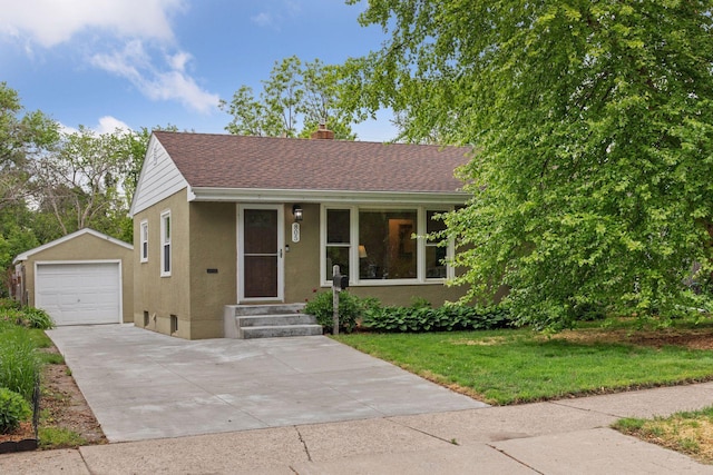 805 California Ave W, Saint Paul, MN 55117 - view of front of property featuring driveway, a chimney, an outdoor structure, stucco siding, and a garage