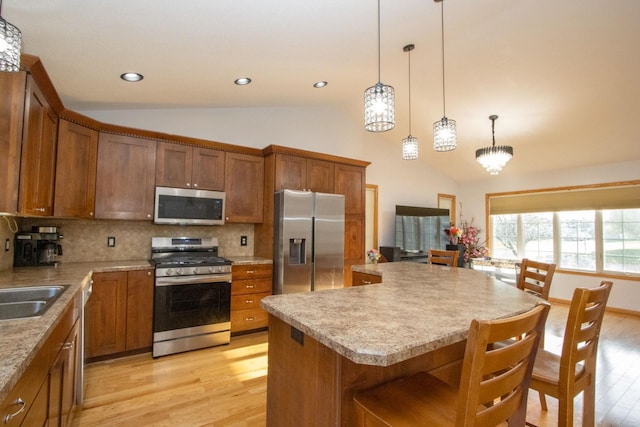 147 Waynesborough Way, Mankato, MN 56001 - kitchen with appliances with stainless steel finishes, light wood-type flooring, brown cabinets, decorative backsplash, and recessed lighting