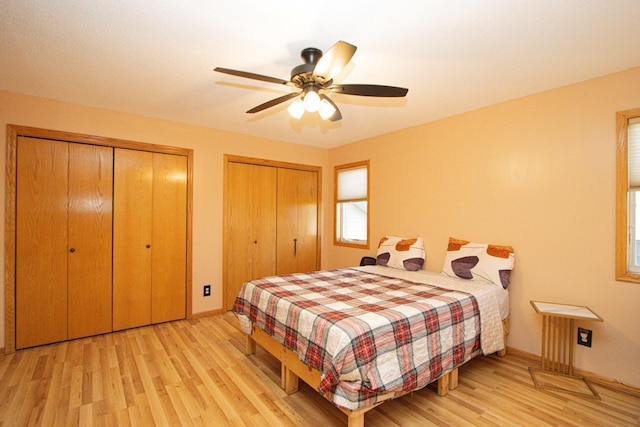 147 Waynesborough Way, Mankato, MN 56001 - bedroom featuring two closets, wood finished floors, baseboards, and a ceiling fan
