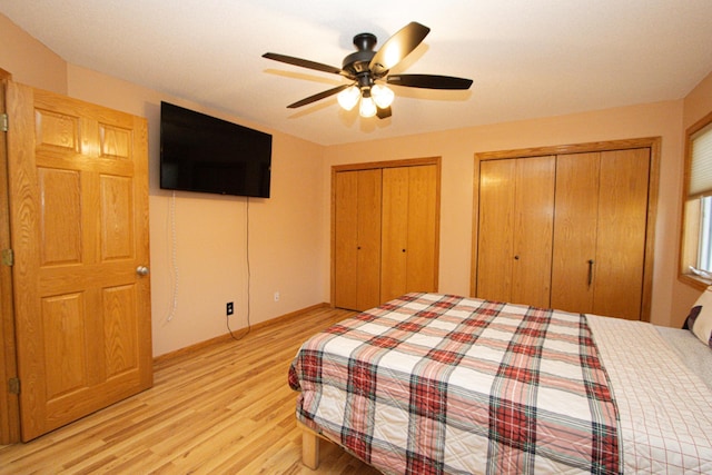 147 Waynesborough Way, Mankato, MN 56001 - bedroom with light wood-style floors, two closets, baseboards, and ceiling fan