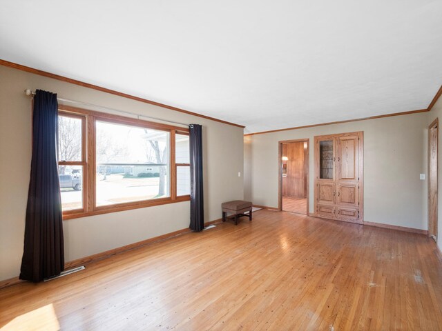 116 California Ave, Morris, MN 56267 - empty room featuring light wood-style floors, ornamental molding, and baseboards
