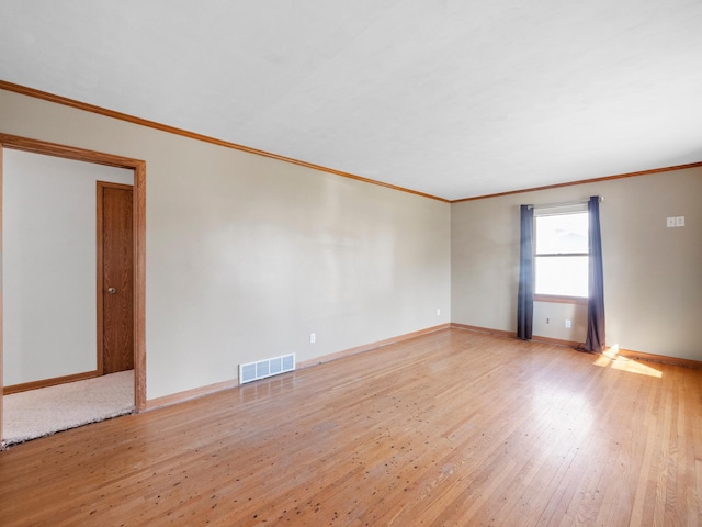 116 California Ave, Morris, MN 56267 - unfurnished room featuring hardwood / wood-style flooring, crown molding, and baseboards