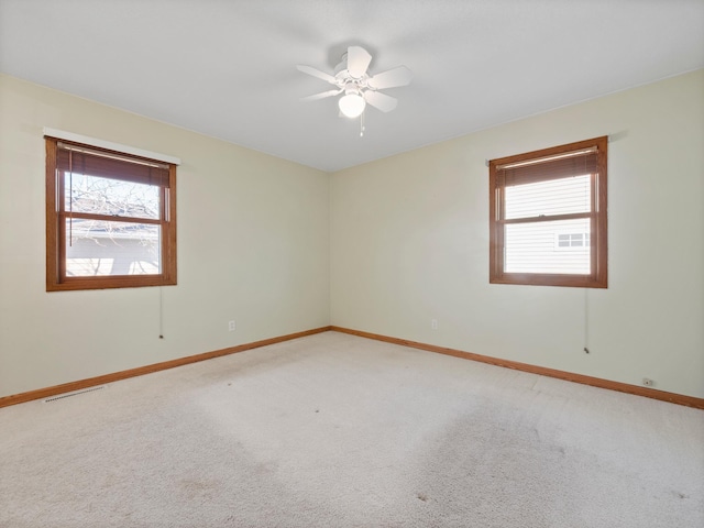 116 California Ave, Morris, MN 56267 - empty room with light carpet, baseboards, and a ceiling fan