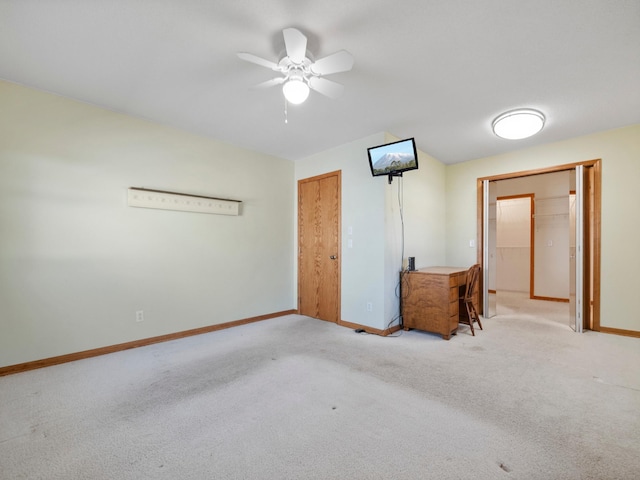 116 California Ave, Morris, MN 56267 - unfurnished bedroom featuring baseboards, light carpet, and ceiling fan