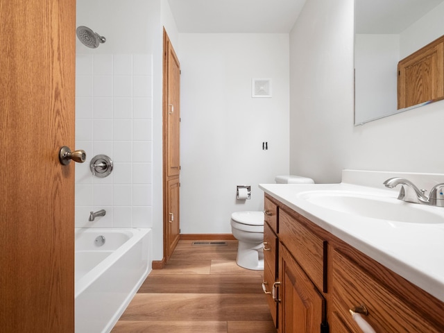 116 California Ave, Morris, MN 56267 - full bath with wood finished floors, vanity, toilet, and  shower combination