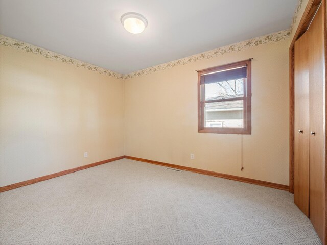 116 California Ave, Morris, MN 56267 - unfurnished bedroom featuring light colored carpet and baseboards