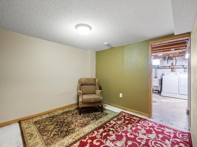 116 California Ave, Morris, MN 56267 - sitting room featuring separate washer and dryer and a textured ceiling