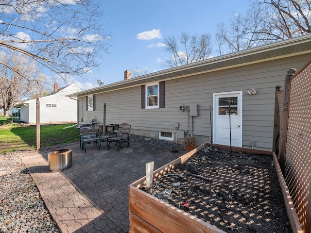 116 California Ave, Morris, MN 56267 - back of property with a patio and a chimney