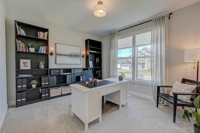 office featuring light colored carpet and baseboards