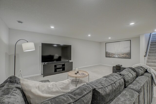 living area featuring light colored carpet, stairs, recessed lighting, and baseboards