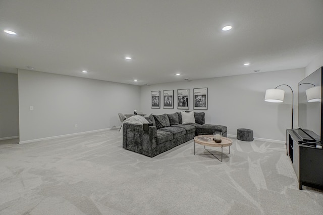 living area with light colored carpet, recessed lighting, and baseboards