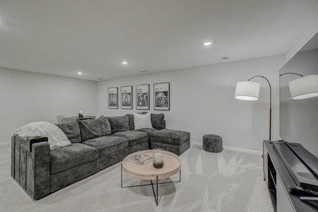 living room featuring carpet flooring, baseboards, and recessed lighting