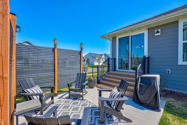 view of patio / terrace with fence and entry steps