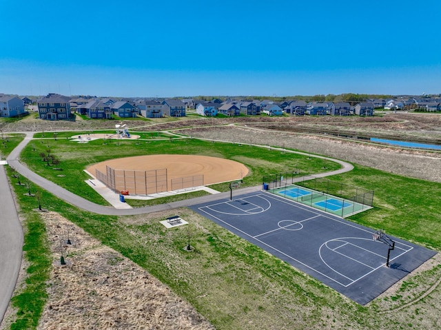 aerial perspective of suburban area with a large body of water