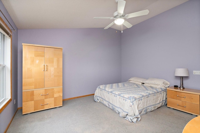 16322 70th Ave N Unit 304, Maple Grove, MN 55311 - carpeted bedroom featuring vaulted ceiling, baseboards, and ceiling fan