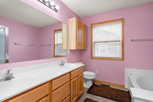 16322 70th Ave N Unit 304, Maple Grove, MN 55311 - full bathroom with toilet, a bath, double vanity, tile patterned floors, and baseboards