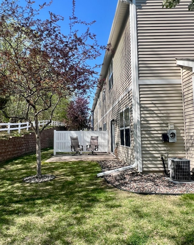 16322 70th Ave N Unit 304, Maple Grove, MN 55311 - view of yard featuring a patio area and central AC