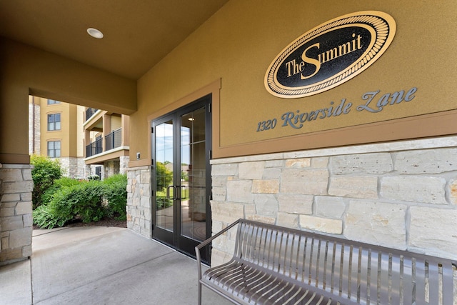 1320 Riverside Ln Unit 112, Mendota Heights, MN 55118 - doorway to property featuring stone siding and french doors