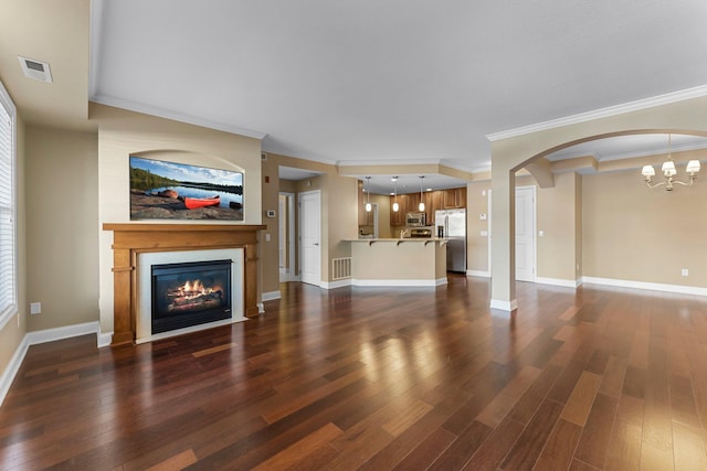 1320 Riverside Ln Unit 112, Mendota Heights, MN 55118 - unfurnished living room featuring ornamental molding, a fireplace with flush hearth, dark wood-type flooring, a chandelier, and arched walkways