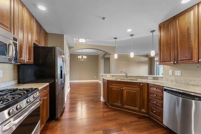 1320 Riverside Ln Unit 112, Mendota Heights, MN 55118 - kitchen with stainless steel appliances, arched walkways, a peninsula, a chandelier, and dark wood finished floors
