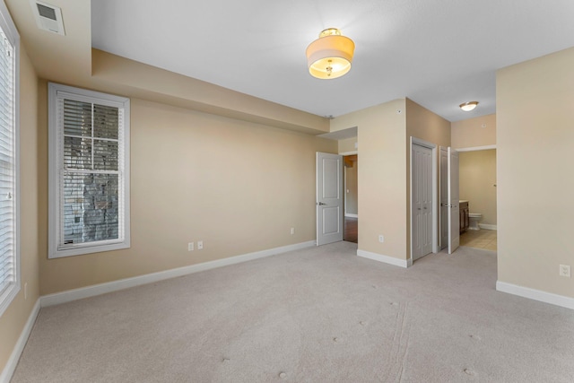 1320 Riverside Ln Unit 112, Mendota Heights, MN 55118 - unfurnished bedroom with light colored carpet and ensuite bath