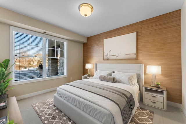 1320 Riverside Ln Unit 112, Mendota Heights, MN 55118 - bedroom featuring carpet floors, multiple windows, an accent wall, and wooden walls