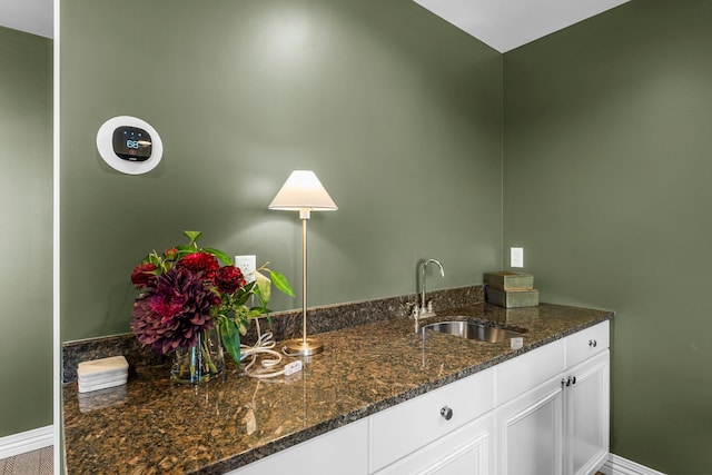 1320 Riverside Ln Unit 112, Mendota Heights, MN 55118 - kitchen with white cabinets and dark stone counters