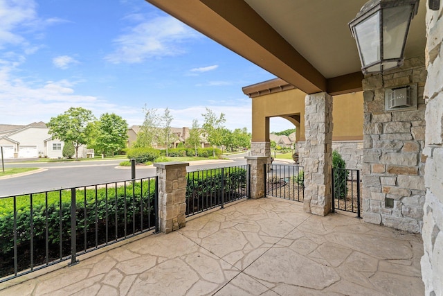 1320 Riverside Ln Unit 112, Mendota Heights, MN 55118 - covered porch featuring a residential view