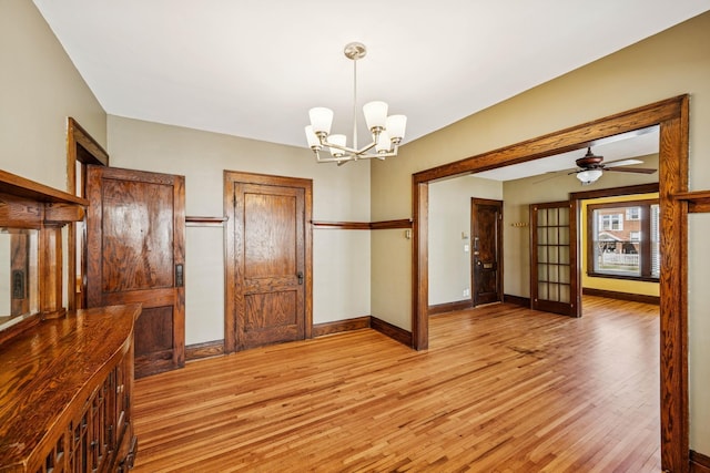 3441 Portland Ave Unit 1, Minneapolis, MN 55407 - unfurnished dining area with light wood-type flooring, a chandelier, and baseboards