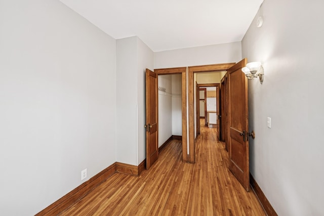 3441 Portland Ave Unit 1, Minneapolis, MN 55407 - unfurnished bedroom with light wood-style flooring, baseboards, and a closet