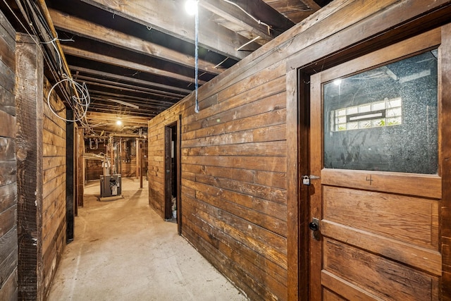 3441 Portland Ave Unit 1, Minneapolis, MN 55407 - corridor featuring wooden walls and unfinished concrete floors