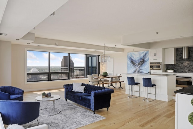 living area featuring light wood-style flooring