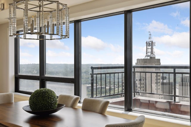 dining room featuring plenty of natural light and a chandelier
