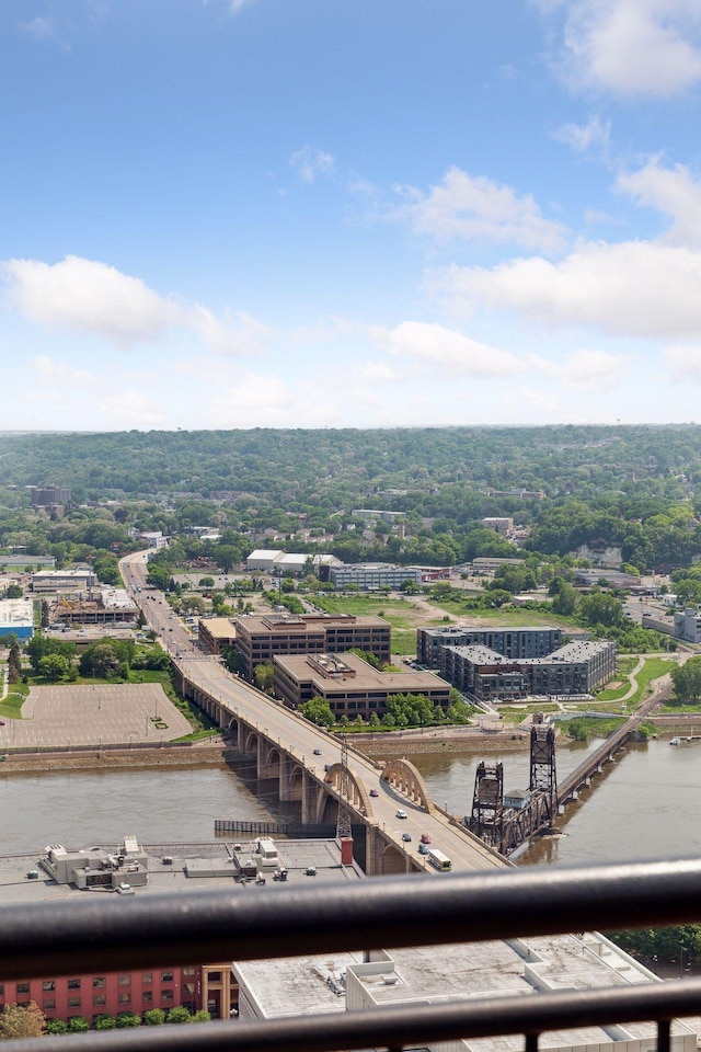 view of urban area featuring a notable bridge and a nearby body of water