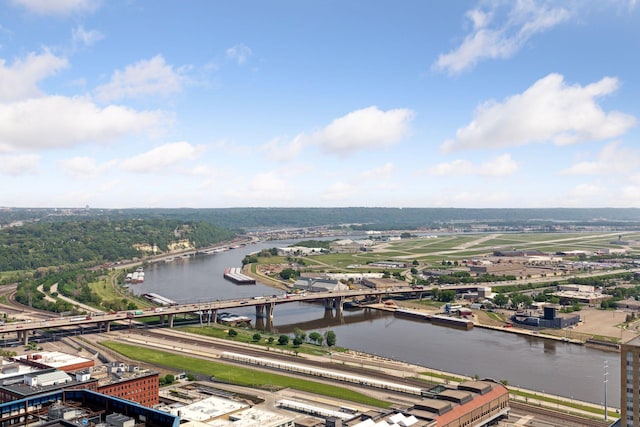 bird's eye view of a nearby body of water, a notable bridge, and a main thoroughfare