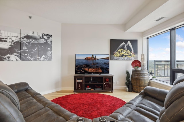 living area featuring wood finished floors and baseboards