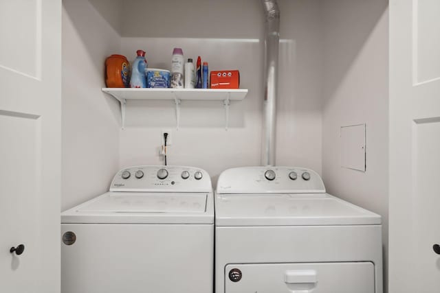washroom with washing machine and clothes dryer