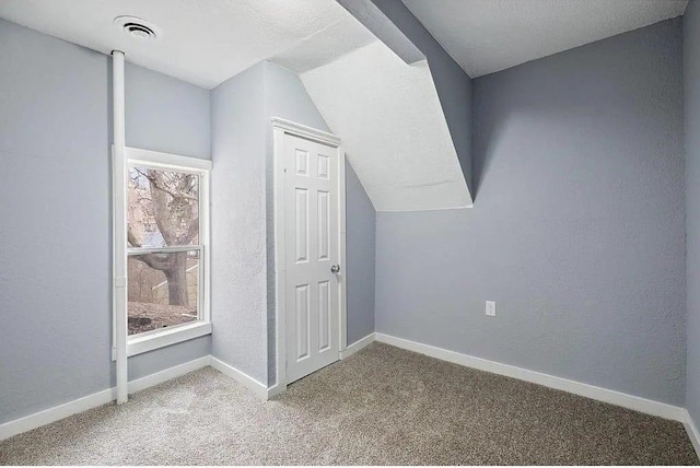 2723 Dupont Ave N, Minneapolis, MN 55411 - bonus room with carpet flooring, baseboards, and lofted ceiling