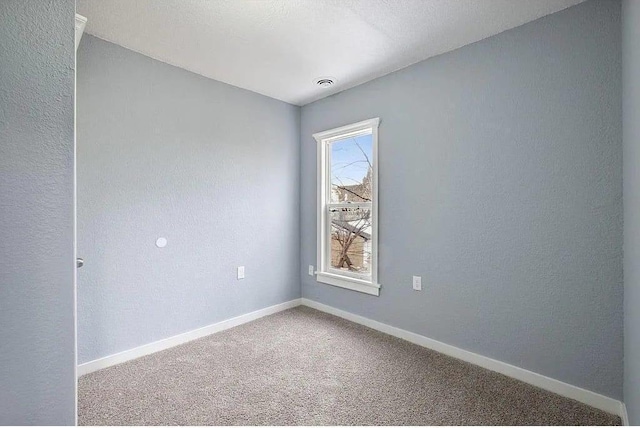 2723 Dupont Ave N, Minneapolis, MN 55411 - carpeted spare room with baseboards