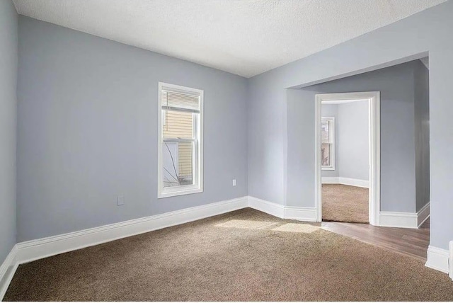 2723 Dupont Ave N, Minneapolis, MN 55411 - carpeted empty room featuring baseboards