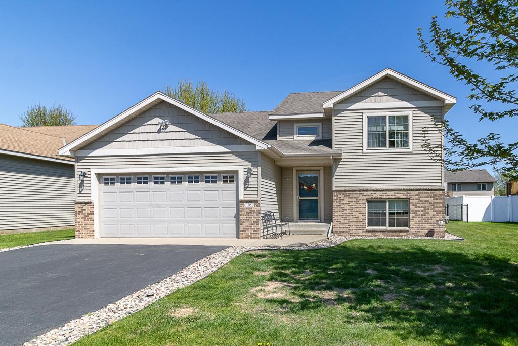 105 Doral Dr, Mankato, MN 56001 - craftsman-style house with brick siding, asphalt driveway, and a garage