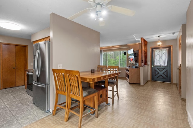 8251 158th Ln NW, Ramsey, MN 55303 - dining area featuring ceiling fan, light flooring, and baseboards