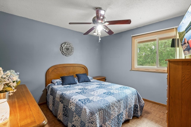 8251 158th Ln NW, Ramsey, MN 55303 - bedroom with a textured ceiling, baseboards, and a ceiling fan