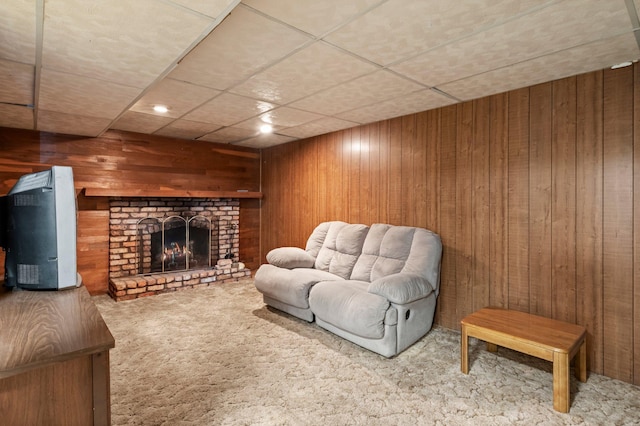 8251 158th Ln NW, Ramsey, MN 55303 - living room with carpet flooring, wooden walls, a fireplace, and a paneled ceiling