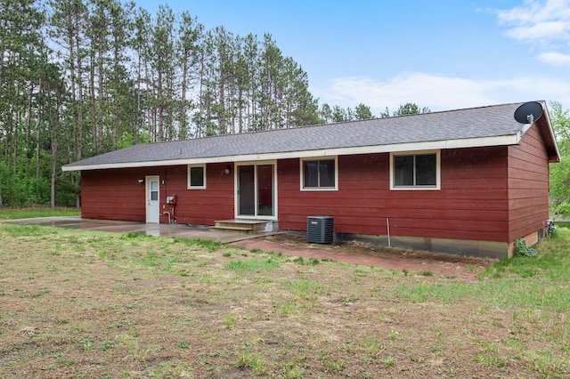 8251 158th Ln NW, Ramsey, MN 55303 - rear view of house featuring central air condition unit, a patio, a yard, and roof with shingles