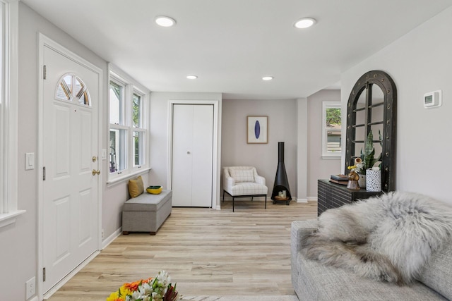 entrance foyer featuring recessed lighting, light wood finished floors, and baseboards